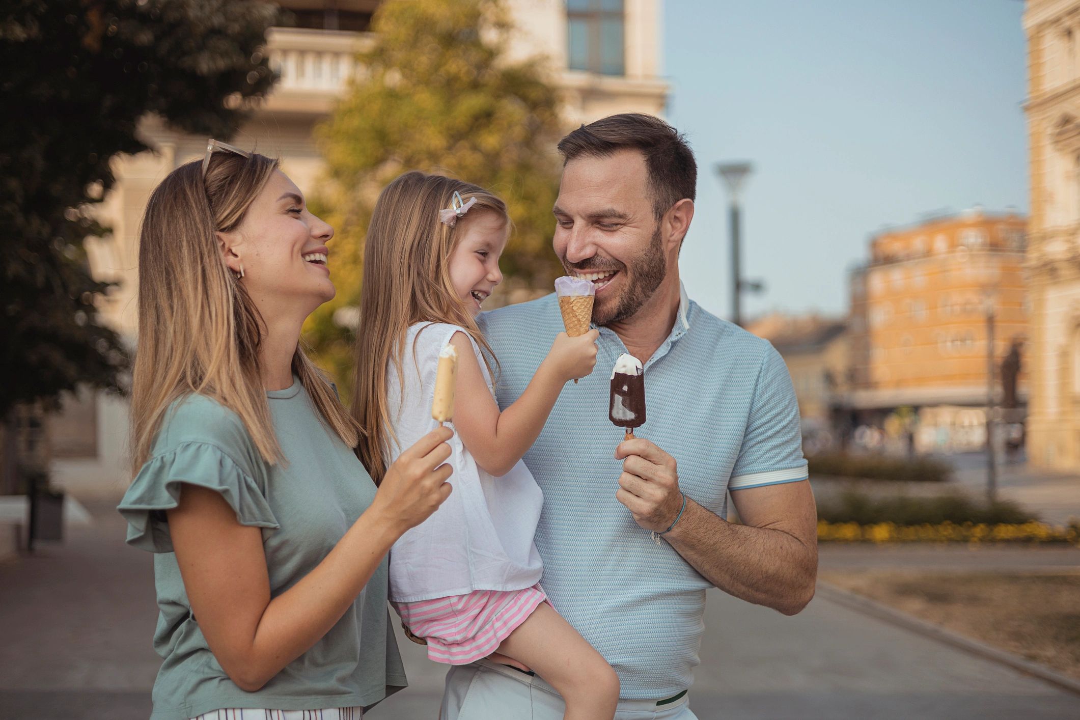Family enjoying ice cream outdoors